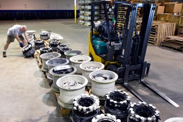 A lineup of aircraft wheels in the warehouse